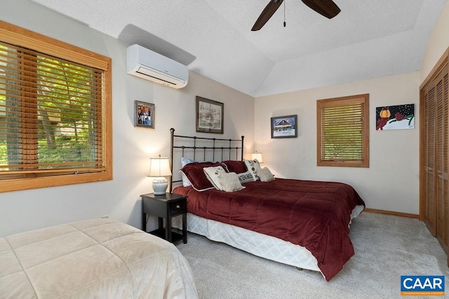 32 Stony Cove Ln, Wintergreen Resort, VA 22967 - bedroom featuring an AC wall unit, multiple windows, carpet flooring, a closet, and lofted ceiling