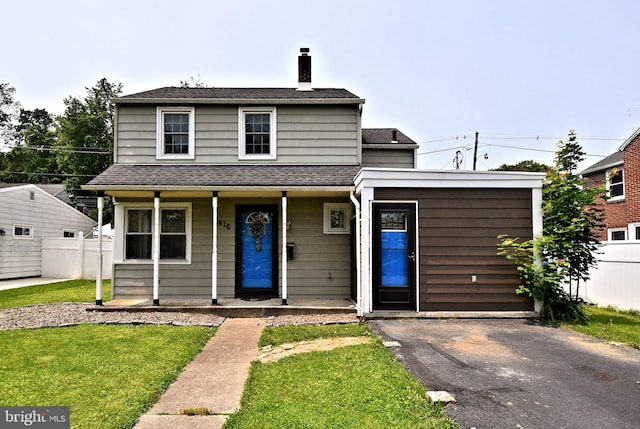 816 Margaret St, Reading, PA 19611 - view of front facade featuring a chimney, a porch, and roof with shingles