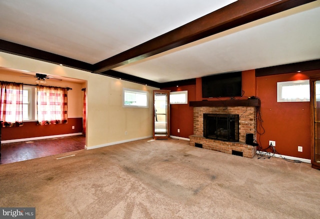816 Margaret St, Reading, PA 19611 - unfurnished living room with carpet flooring, beamed ceiling, a fireplace, and baseboards