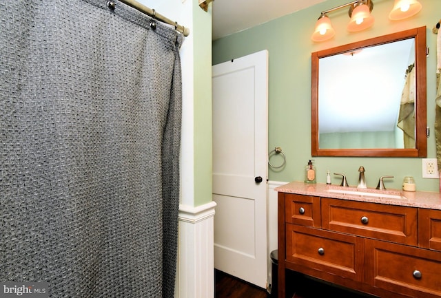 816 Margaret St, Reading, PA 19611 - full bath featuring vanity, curtained shower, and wood finished floors