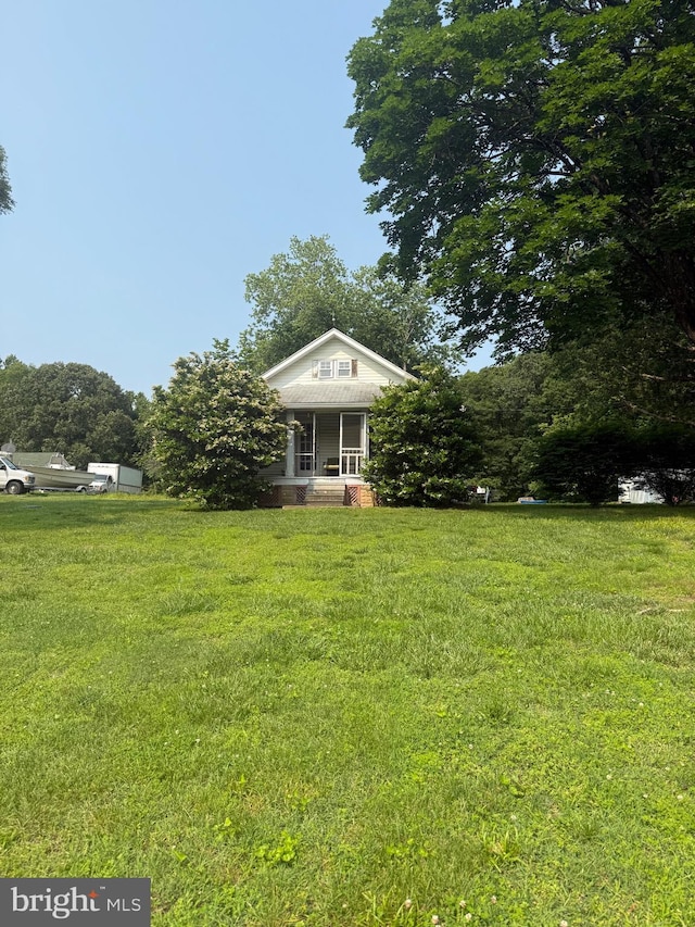 9860 Hg Trueman Rd, Lusby, MD 20657 - view of front of property featuring a front lawn and a porch