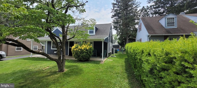 424 Exton Rd, Hatboro, PA 19040 - view of front of property featuring a front yard and a sunroom