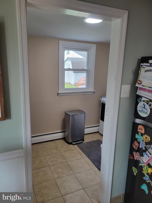 424 Exton Rd, Hatboro, PA 19040 - laundry room with a baseboard radiator and light tile patterned flooring