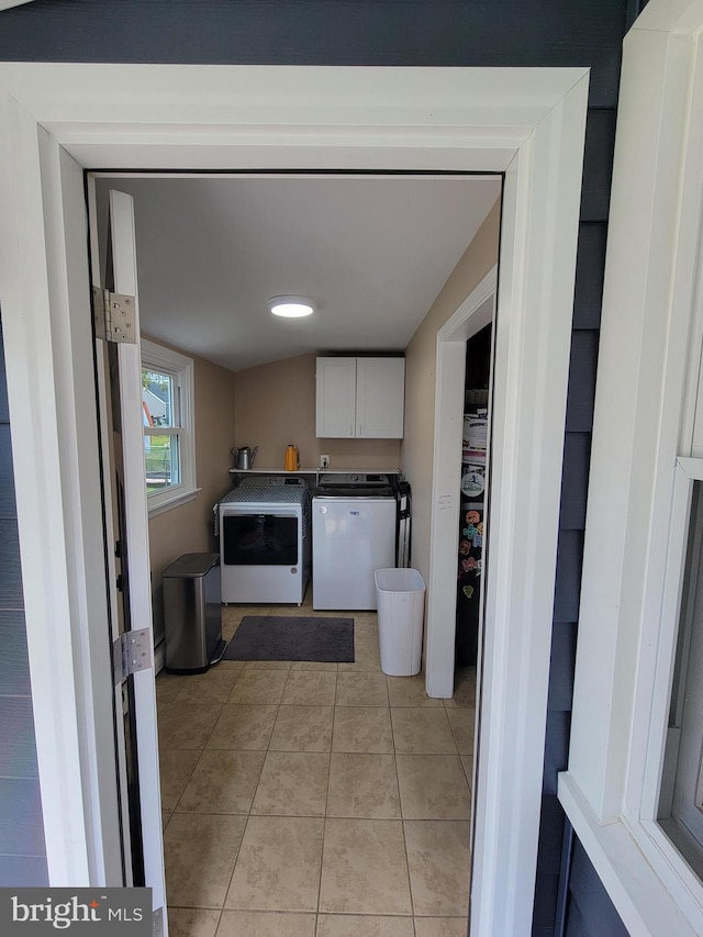 424 Exton Rd, Hatboro, PA 19040 - laundry area with cabinet space, washing machine and clothes dryer, and light tile patterned flooring