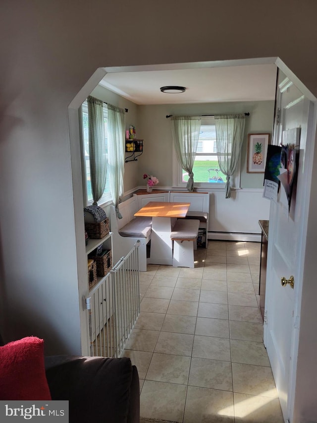 424 Exton Rd, Hatboro, PA 19040 - dining space with baseboard heating, breakfast area, and light tile patterned flooring