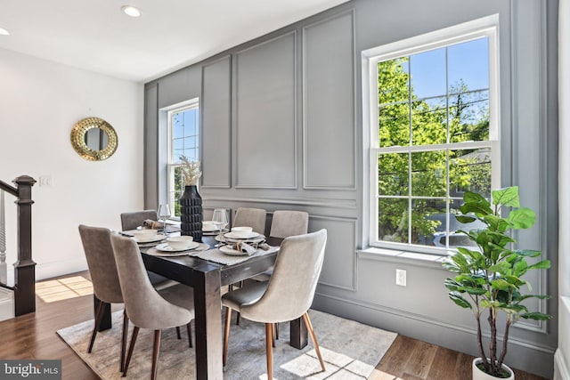 322 56th St NE, Washington, DC 20019 - dining room featuring a decorative wall, wood finished floors, recessed lighting, stairway, and baseboards