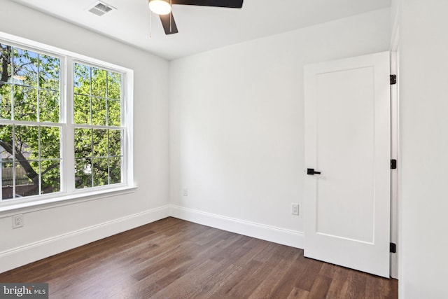 322 56th St NE, Washington, DC 20019 - spare room with ceiling fan, dark wood finished floors, and baseboards
