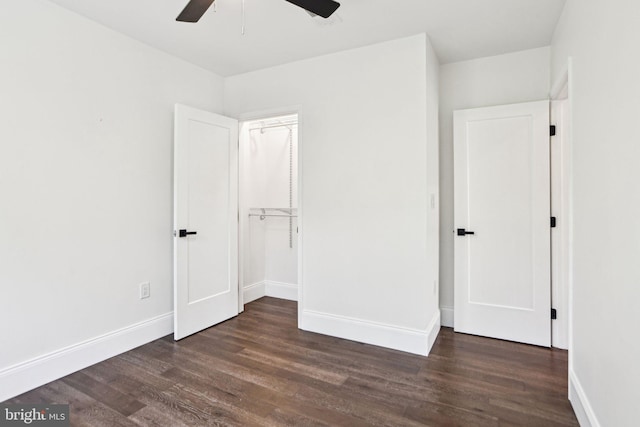 322 56th St NE, Washington, DC 20019 - unfurnished bedroom with dark wood finished floors, baseboards, and a ceiling fan