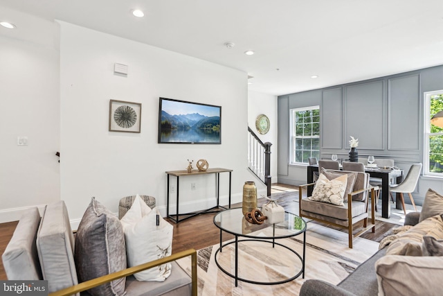 322 56th St NE, Washington, DC 20019 - living area featuring stairway, wood finished floors, recessed lighting, and a decorative wall