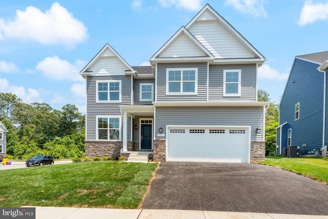 114 Retriever Way, Severna Park, MD 21146 - craftsman house featuring stone siding, driveway, a front yard, and an attached garage