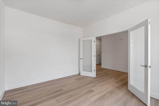 114 Retriever Way, Severna Park, MD 21146 - unfurnished bedroom featuring french doors and light wood-style floors