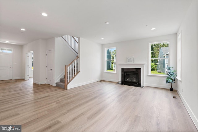 114 Retriever Way, Severna Park, MD 21146 - unfurnished living room with stairway, light wood-style floors, recessed lighting, and a fireplace