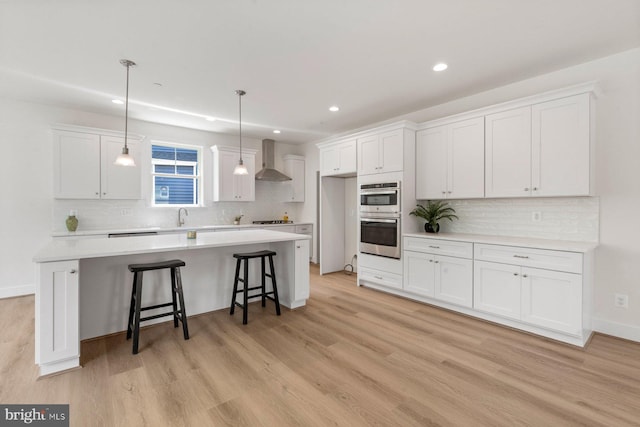 114 Retriever Way, Severna Park, MD 21146 - kitchen featuring wall chimney exhaust hood, stainless steel double oven, decorative backsplash, white cabinets, and recessed lighting