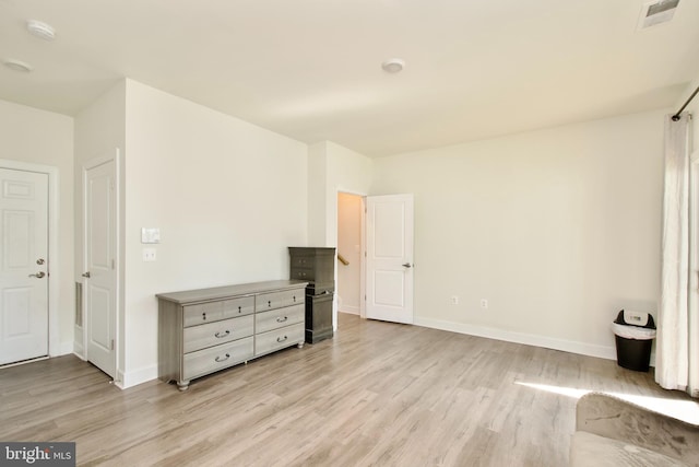 45401 Daveno Sq, Sterling, VA 20164 - unfurnished living room featuring light wood-style floors and baseboards