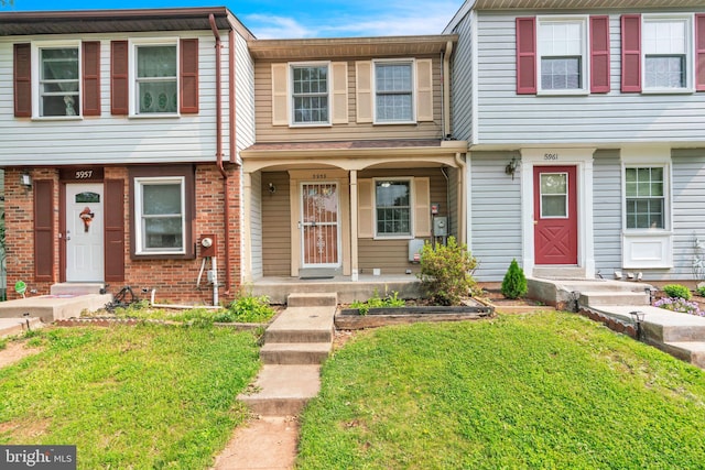 5959 Rowanberry Dr Unit 8E, Elkridge, MD 21075 - townhome / multi-family property with a front yard and covered porch