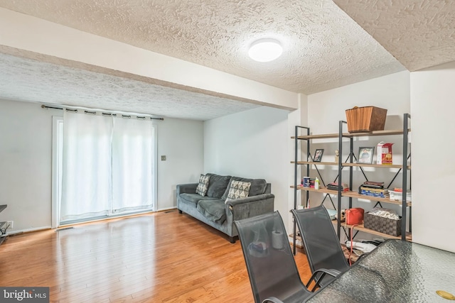 5959 Rowanberry Dr Unit 8E, Elkridge, MD 21075 - living room featuring a textured ceiling and wood finished floors