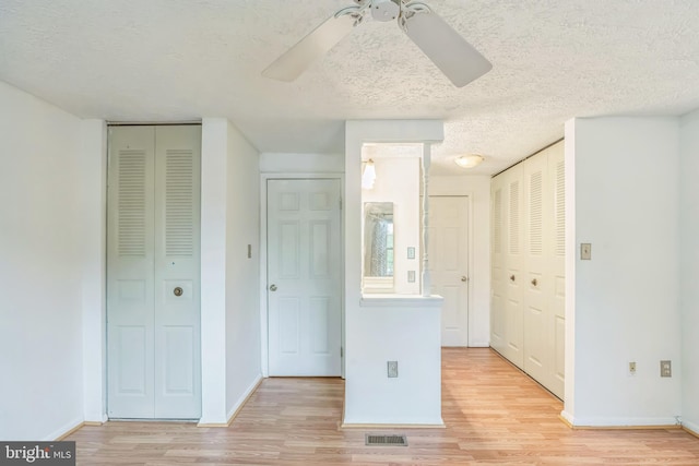 5959 Rowanberry Dr Unit 8E, Elkridge, MD 21075 - unfurnished bedroom featuring light wood finished floors, a textured ceiling, and baseboards