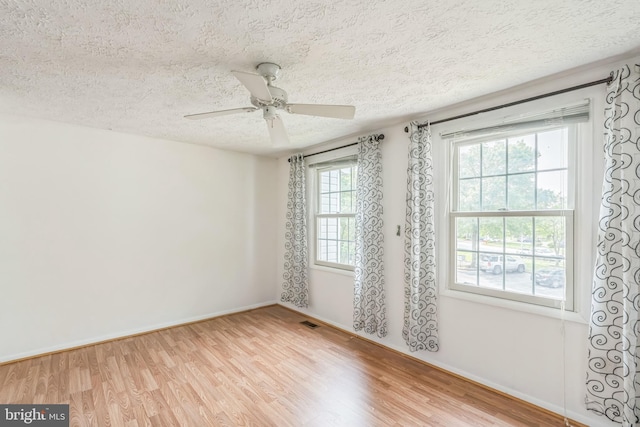 5959 Rowanberry Dr Unit 8E, Elkridge, MD 21075 - empty room with a textured ceiling, wood finished floors, baseboards, and ceiling fan