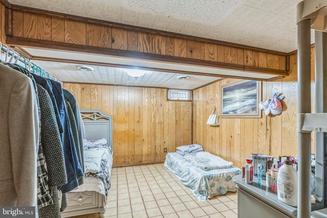 5959 Rowanberry Dr Unit 8E, Elkridge, MD 21075 - bedroom featuring wood walls and light tile patterned floors