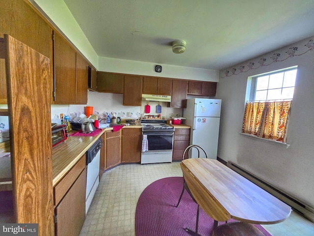 453 Blaker Dr, East Greenville, PA 18041 - kitchen with white appliances, under cabinet range hood, light countertops, and light floors