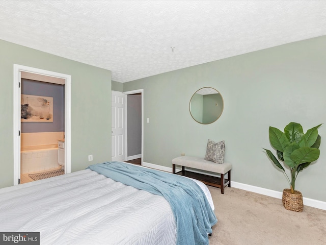 6505 Springwater Ct Unit 7103, Frederick, MD 21701 - carpeted bedroom featuring baseboards, a textured ceiling, and ensuite bath