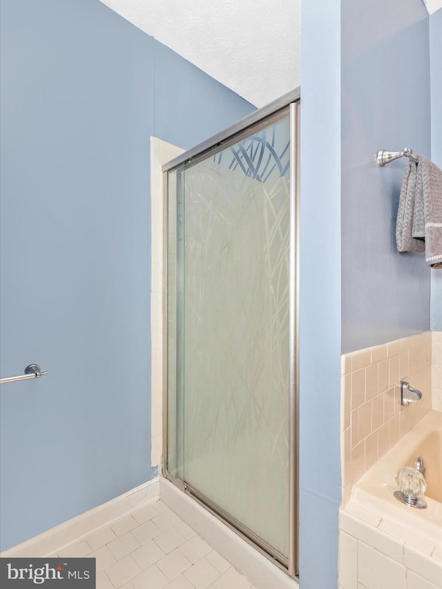 6505 Springwater Ct Unit 7103, Frederick, MD 21701 - full bath with tile patterned floors, a bath, and a shower stall