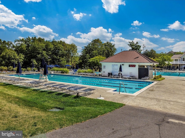 6505 Springwater Ct Unit 7103, Frederick, MD 21701 - community pool featuring a patio area and view of scattered trees