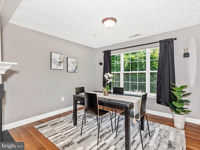 6505 Springwater Ct Unit 7103, Frederick, MD 21701 - dining area with wood finished floors, baseboards, and a textured ceiling