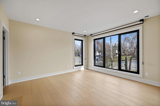 1573 Westmoreland St, Mclean, VA 22101 - unfurnished room with wood finished floors, baseboards, and recessed lighting