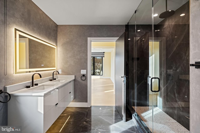 1573 Westmoreland St, Mclean, VA 22101 - bathroom featuring marble tiled flooring, double vanity, and a stall shower