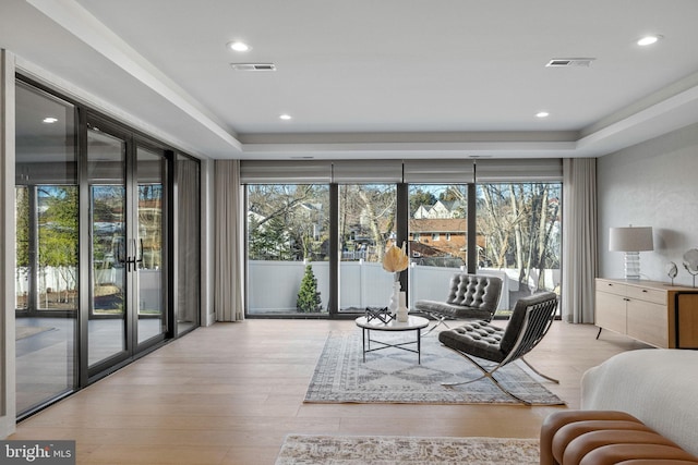 1573 Westmoreland St, Mclean, VA 22101 - living area with healthy amount of natural light, a raised ceiling, wood finished floors, and recessed lighting