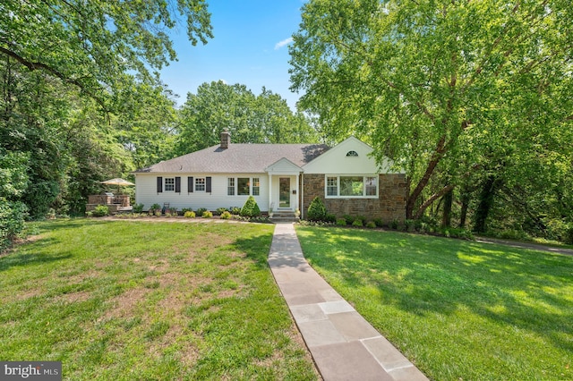 653 Broad Acres Rd, Penn Valley, PA 19072 - ranch-style home featuring a front yard, stone siding, and a chimney