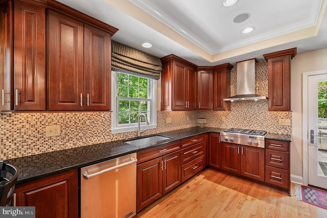 653 Broad Acres Rd, Penn Valley, PA 19072 - kitchen with appliances with stainless steel finishes, a sink, wall chimney range hood, light wood finished floors, and crown molding