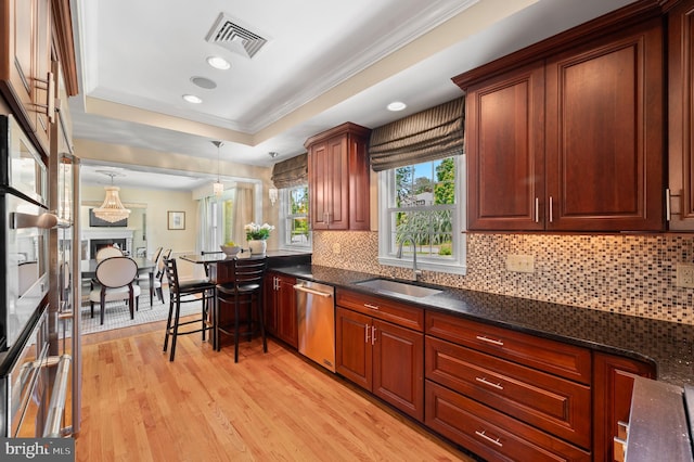 653 Broad Acres Rd, Penn Valley, PA 19072 - kitchen with stainless steel dishwasher, light wood-style floors, tasteful backsplash, a sink, and crown molding