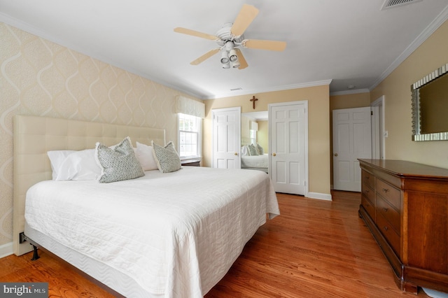 653 Broad Acres Rd, Penn Valley, PA 19072 - bedroom with wood finished floors, crown molding, baseboards, and a ceiling fan