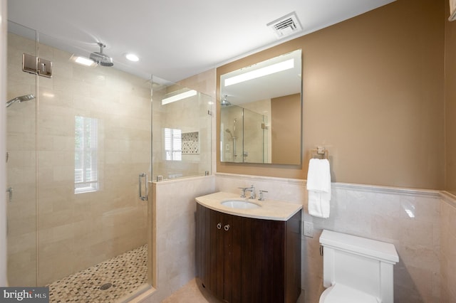 653 Broad Acres Rd, Penn Valley, PA 19072 - full bathroom with a stall shower, vanity, toilet, and tile walls