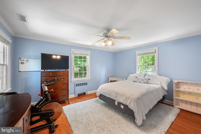 653 Broad Acres Rd, Penn Valley, PA 19072 - bedroom with radiator, wood finished floors, crown molding, baseboards, and a ceiling fan