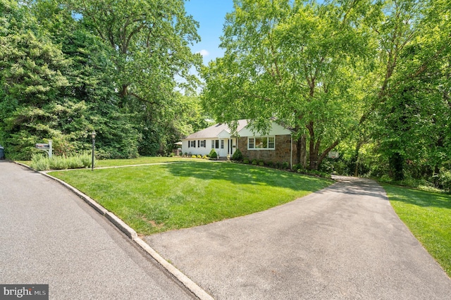 653 Broad Acres Rd, Penn Valley, PA 19072 - single story home with a front yard