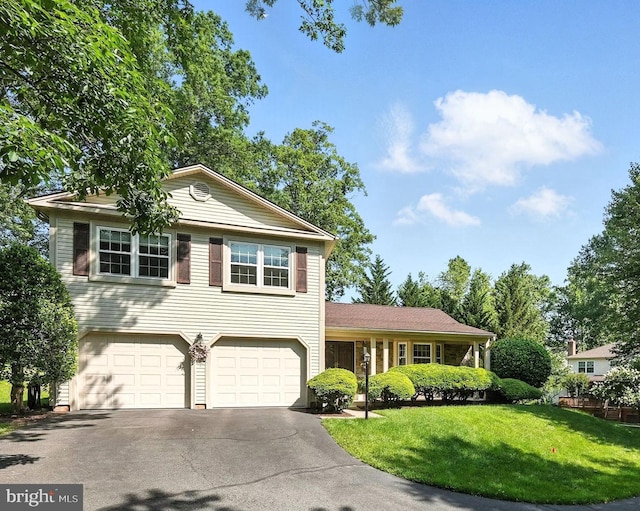 3382 Flint Hill Pl, Woodbridge, VA 22192 - split level home featuring asphalt driveway, an attached garage, and a front yard