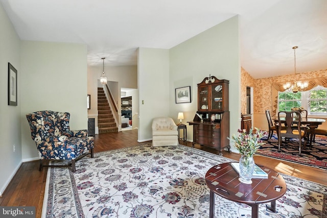 3382 Flint Hill Pl, Woodbridge, VA 22192 - living area featuring stairway, a chandelier, wood finished floors, and vaulted ceiling