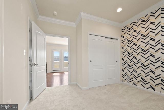 817 Fair Winds Way Unit 290, Oxon Hill, MD 20745 - unfurnished bedroom with carpet flooring, crown molding, baseboards, an accent wall, and a closet