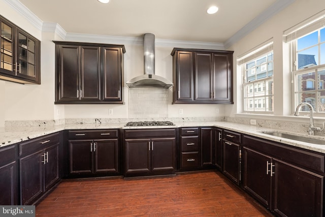 817 Fair Winds Way Unit 290, Oxon Hill, MD 20745 - kitchen featuring wall chimney exhaust hood, a sink, stainless steel gas stovetop, light stone countertops, and dark wood-type flooring
