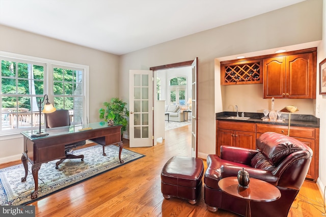 9111 Oak Chase Ct, Fairfax Station, VA 22039 - office area with wet bar, light wood-type flooring, and french doors