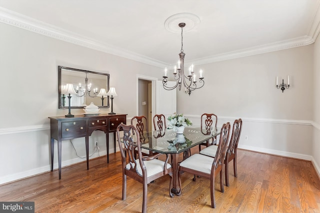 9111 Oak Chase Ct, Fairfax Station, VA 22039 - dining room with a chandelier, crown molding, and light wood-style floors