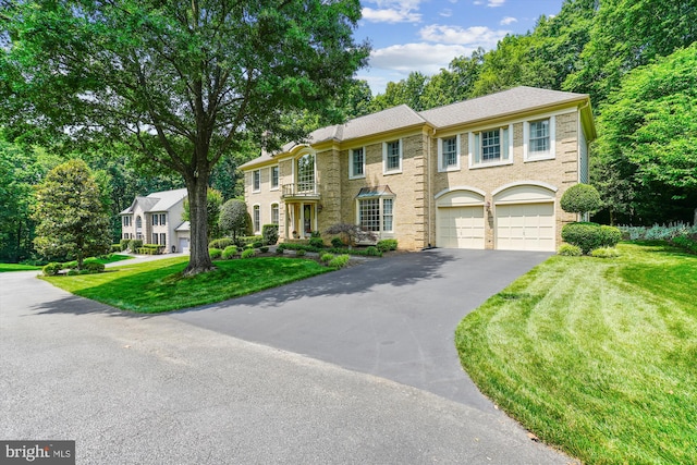 9111 Oak Chase Ct, Fairfax Station, VA 22039 - colonial-style house featuring driveway, a garage, and a front lawn