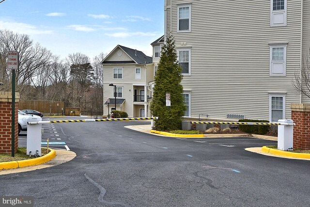 3851 Aristotle Ct Unit 1-412, Fairfax, VA 22030 - view of asphalt road featuring curbs