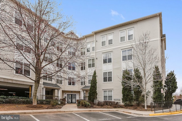 3851 Aristotle Ct Unit 1-412, Fairfax, VA 22030 - view of property featuring uncovered parking