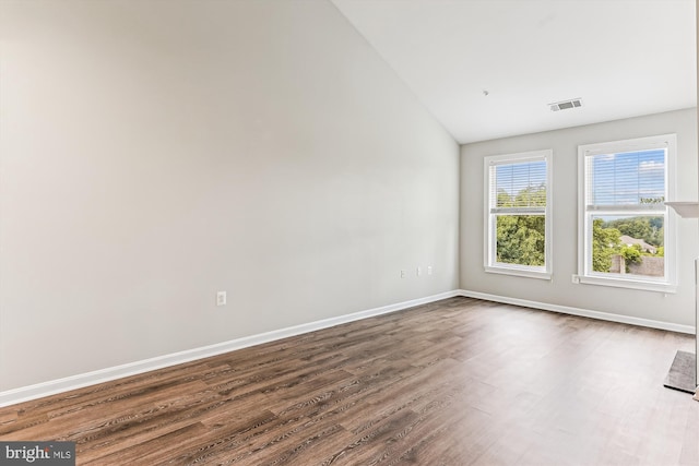 3851 Aristotle Ct Unit 1-412, Fairfax, VA 22030 - unfurnished room featuring vaulted ceiling and dark wood finished floors