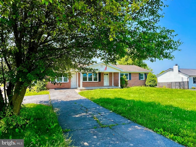 3208 Old Leetown Pike, Ranson, WV 25438 - view of front of home featuring brick siding, asphalt driveway, and a porch