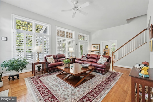 6321 Wilmington Dr, Burke, VA 22015 - living room with a ceiling fan, light wood-style flooring, and stairway